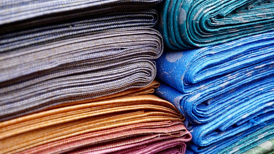 Layered patterned textiles illustrating colour, detail and traditional decorative craft.